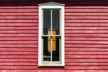 Old White Wooden Window with Red Siding Background