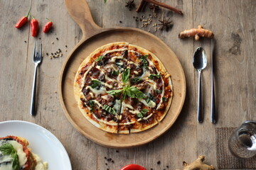 pizza with meat spinach and cheese