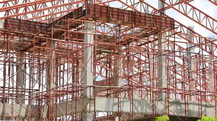 Scaffolding metal prop. Red iron is a props to support formwork slabs on a construction site....