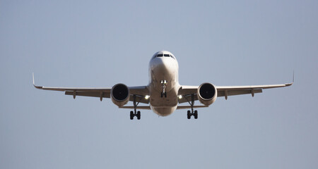 Image of passenger plane landing in airport afternoon at sunny day - obrazy, fototapety, plakaty