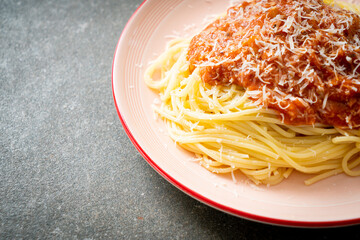 pork bolognese spaghetti with parmesan cheese