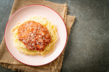 pork bolognese spaghetti with parmesan cheese