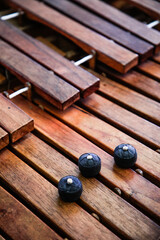 Close-up shot of a marimba keyboard with three ramrod