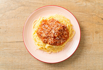 pork bolognese spaghetti with parmesan cheese