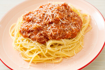 pork bolognese spaghetti with parmesan cheese