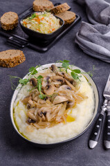 Mashed potatoes with butter, fried mushrooms with onions and salad of fresh vegetables