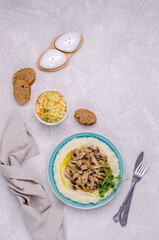 Mashed potatoes with butter, fried mushrooms with onions and salad of fresh vegetables