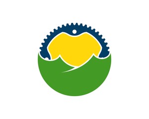 Green hill with bicycle gear and sunset inside