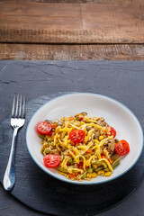 Risotto with mushrooms and cheese and vegetables in a plate.