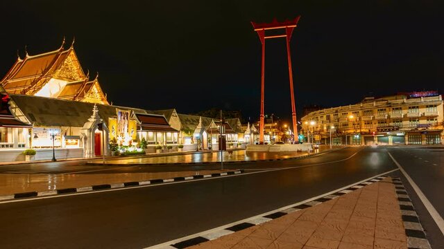 The Giant Swing or Sao Ching Cha monument with Wat Suthat temple at night , Bangkok City, Thailand. Landmark tourist attraction. Thai architecture with travel trip concept.