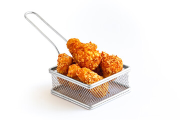 Heap of crispy fried chicken in Mini Iron Fries Fried Basket isolated on white background.
