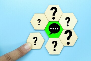 hexagon with questions and answers in the middle or Q and A.