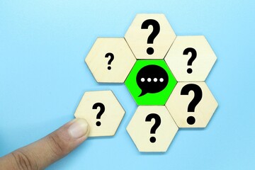 Fototapeta premium hexagon with questions and answers in the middle or Q and A.