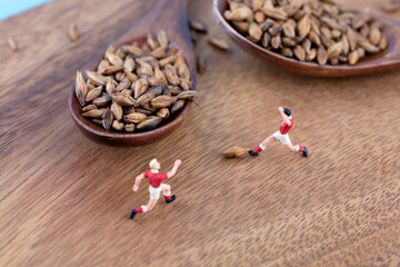 The team practice kicking barley grains on the cutting board