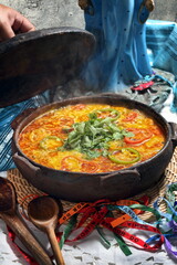 Fish moqueca, a classic dish of Bahian cuisine, served in a clay pot