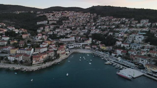 beautiful sunset aerial of boats docking in Kvarner Bay, Rabac, Istria, Croatia.