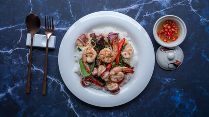Basil fried rice  shrimp squid, Thai food rice stir-fried seafood with chili and basil leaves