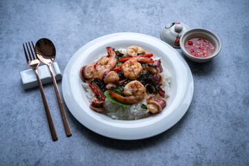 Basil fried rice  shrimp squid, Thai food rice stir-fried seafood with chili and basil leaves