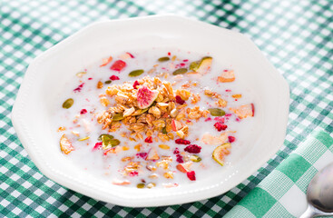 Oatmeal with dried fruit and milk. High quality photo