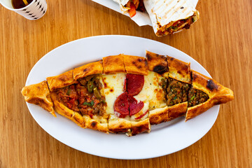 Turkish meat pide on plate. Juicy homemade food
