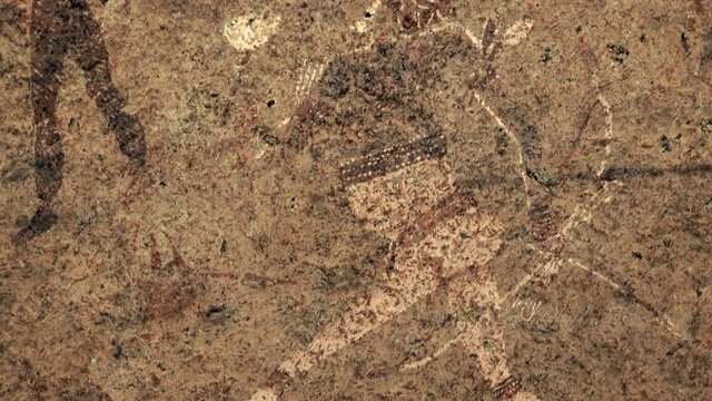 Closeup of ancient prehistoric cave painting known as the White Lady of Brandberg dating back at least 2000 years and located at the foot of Brandberg Mountain in Damaraland, Namibia, Africa.	
