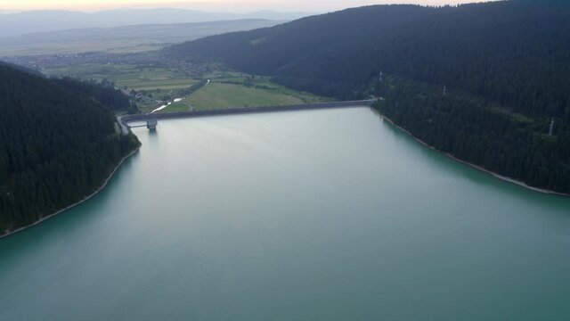 Aerial View Of Frumoasa Dam With Mountain Views At Sunrise In Romania