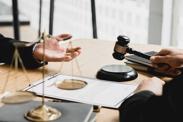 Man judge is currently advising clients on their requests for legal proceedings and legal advice.