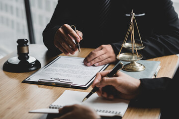 Business lawyer working about legal legislation in courtroom to help their customer