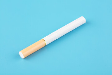 A cigarette on blue background