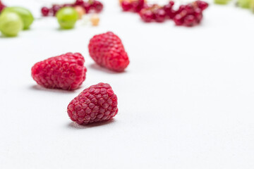Fresh raspberries on white.