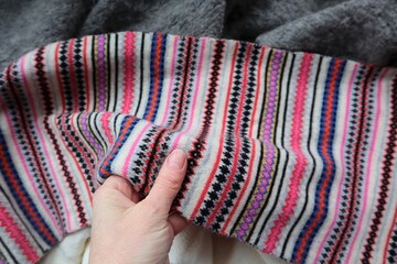 Fair Isle Knit Pattern Style Scarf Held in hand