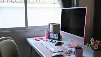 Mock up computer and supplies on white table.