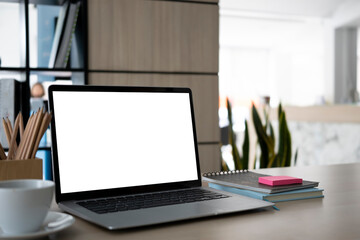 Close up laptop computer with white screen on office desk.