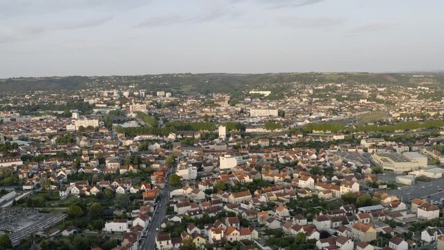 Drone Aerial shot of Montluçon in central France. Montlucon is the largest commune in the Allier department and belongs to the Auvergne-Rhône-Alpes region. A panorama of the french city at sunset.