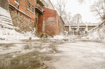 Frozen Aleksupite waterfall in winter day,  Kuldiga, Latvia.