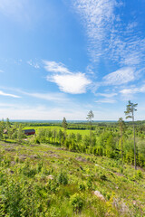 View of a clearcut area and a farm at the farest