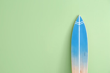 Blue surfboard on color background