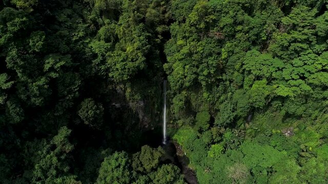Katibawasan Waterfall in green jungle of Philippines, tourist attraction Camiguin