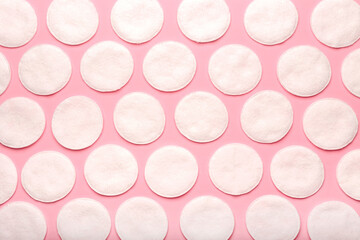 Cotton pads on color background