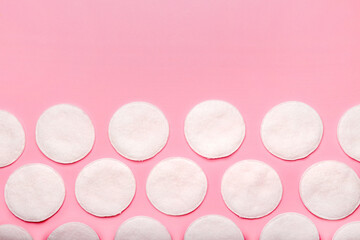 Cotton pads on color background