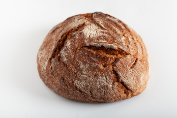 Fresh crusty handcraft bread on white background.