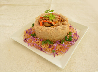 deep fried crispy yam taro ring with stir fried mixed seafood and meat nut in chef oyster sauce asian halal menu