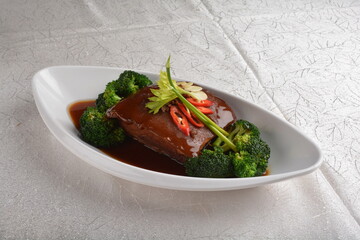 braised pork belly spare ribs trotter with vegetable in dark soy thick sauce fine dining plating...