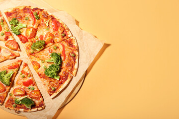 Board with tasty vegetarian pizza on color background