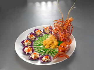 beautiful premium big lobster cold combo platter with seafood scallop, prawn and meat asian halal menu