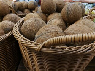 basket of coconuts in a market