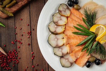 Banquet assorted smoked fish platter on wooden background