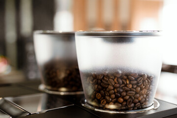 Fototapeta na wymiar Close up coffee beans in a machine jar
