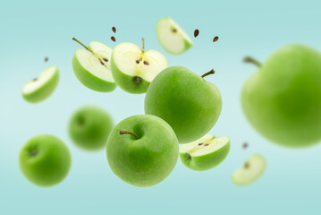 Stack of green Apple falling or flying.Creative levitation food