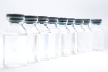 a bottle of vaccine on a white background